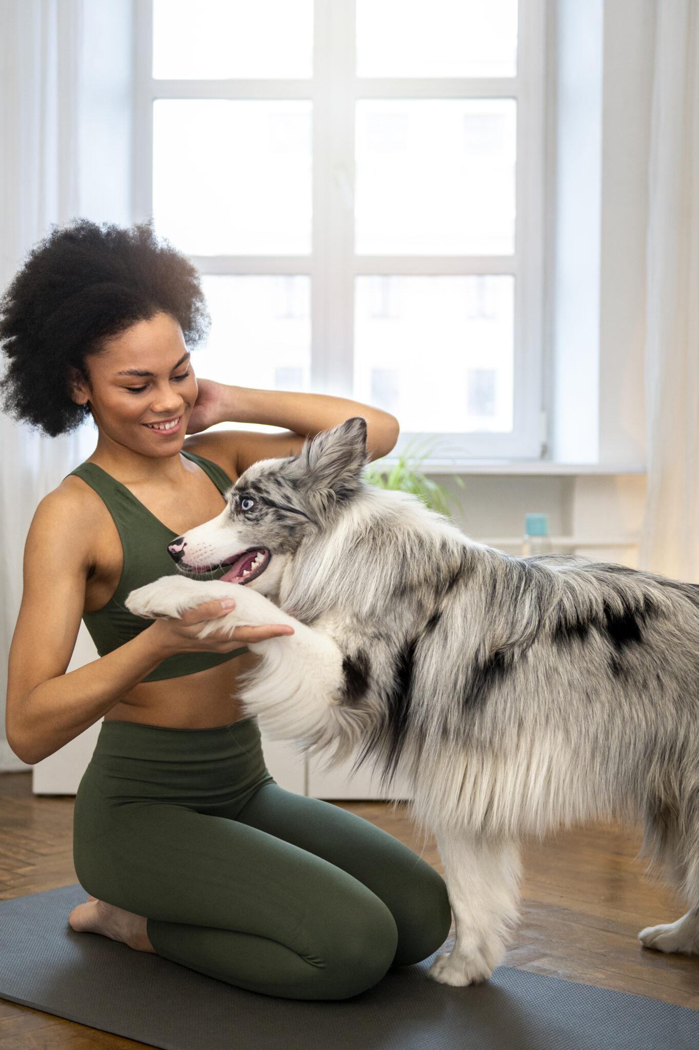 person-doing-yoga-accompanied-by-her-pet